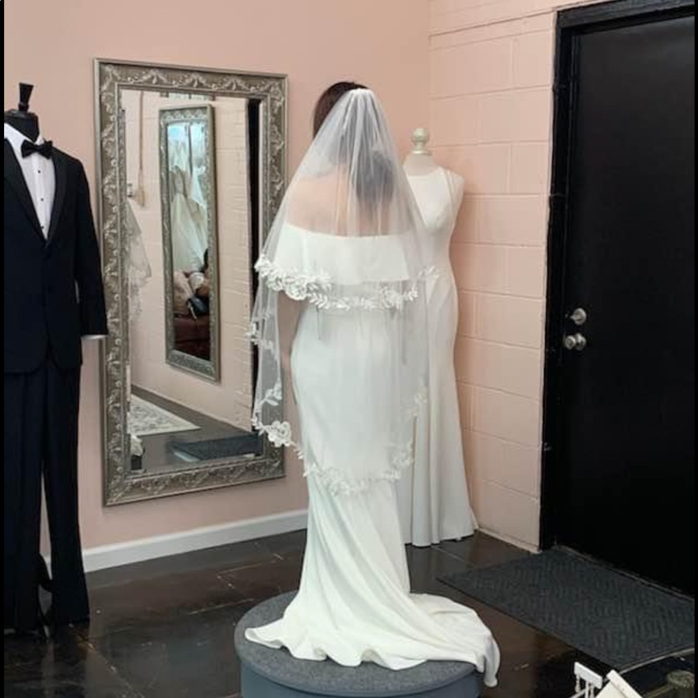 Wedding dress-never worn still in bag, and veil